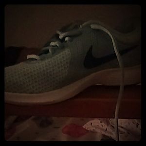 Blue colored Nike shoes size 4